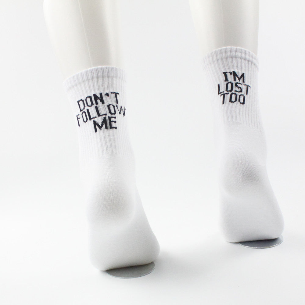 Playful white unisex text socks "Don't follow me, I'm lost too", back