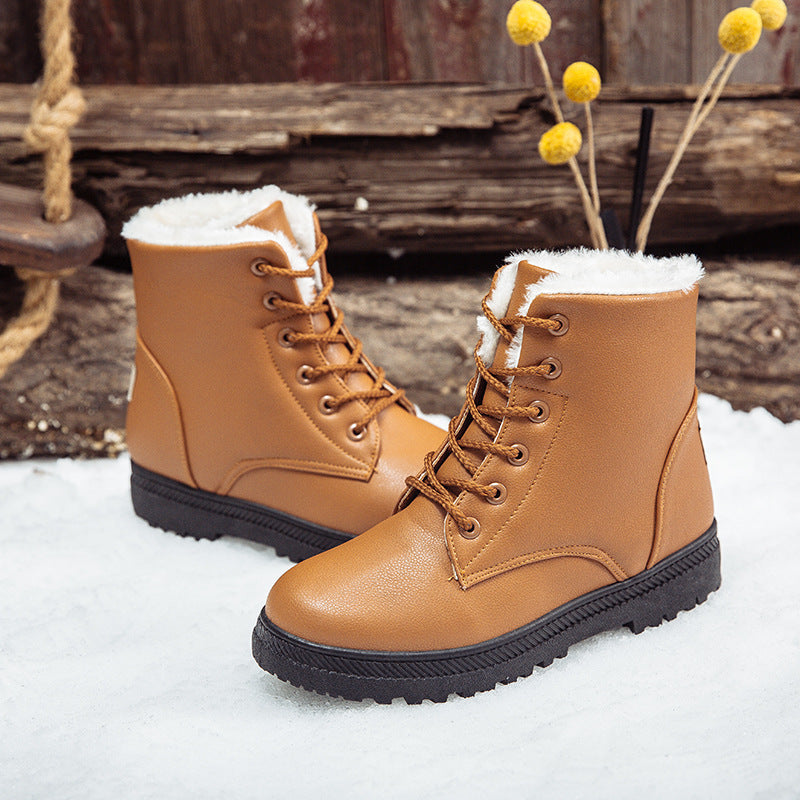Khaki boots on snow background – Women’s khaki winter boots with plush faux-sheepskin lining.