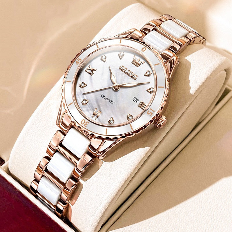 Pearl white dial and rose gold ceramic watch – product photo on display cushion