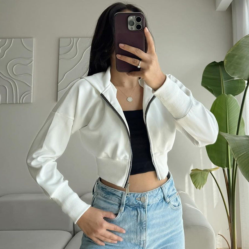 White zip-up cropped hoodie styled with jeans