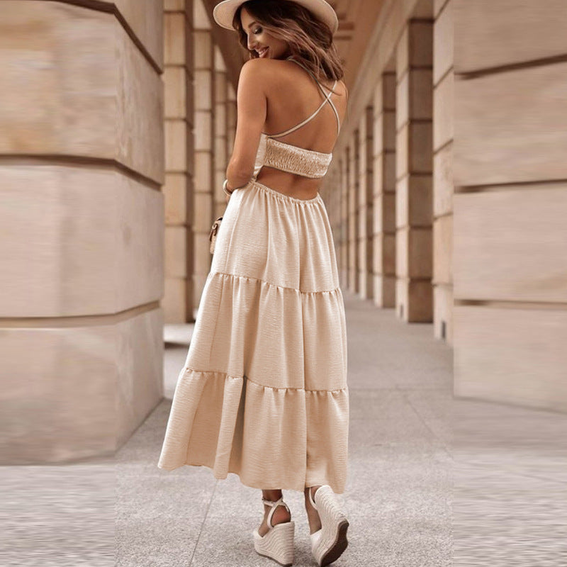 Back view of beige sling maxi dress with criss-cross straps