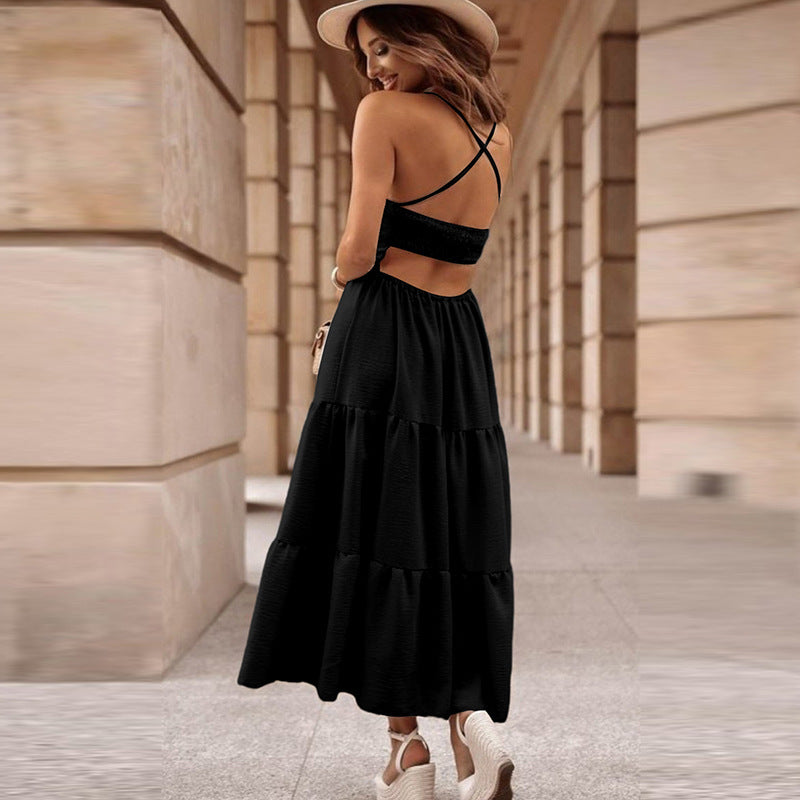 Back view of black sling maxi dress with criss-cross straps