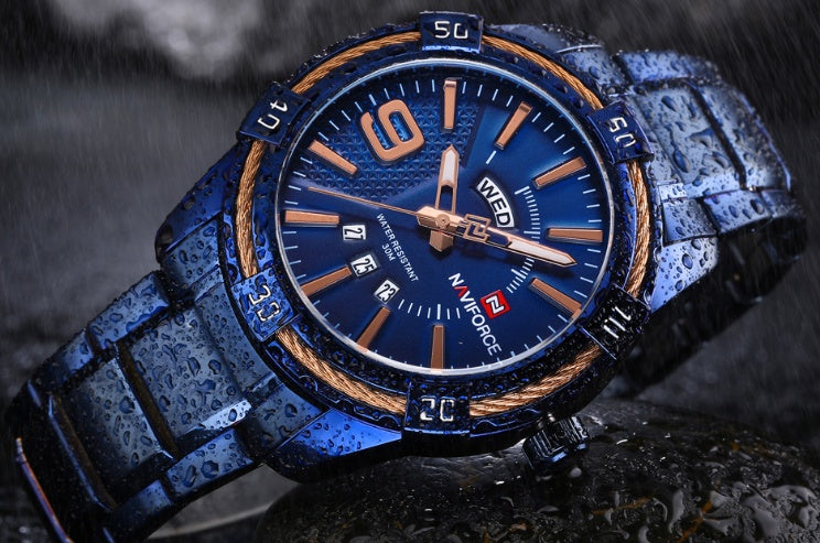 Close-up of blue/gold NAVIFORCE men's watch showcasing bold design and durable materials.