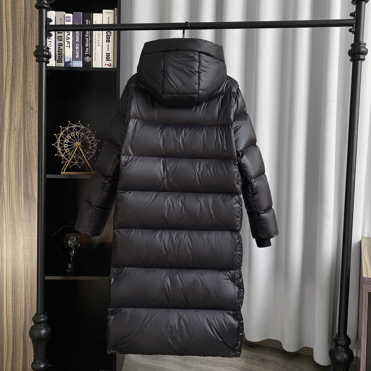 Back view of long puffer coat with hood