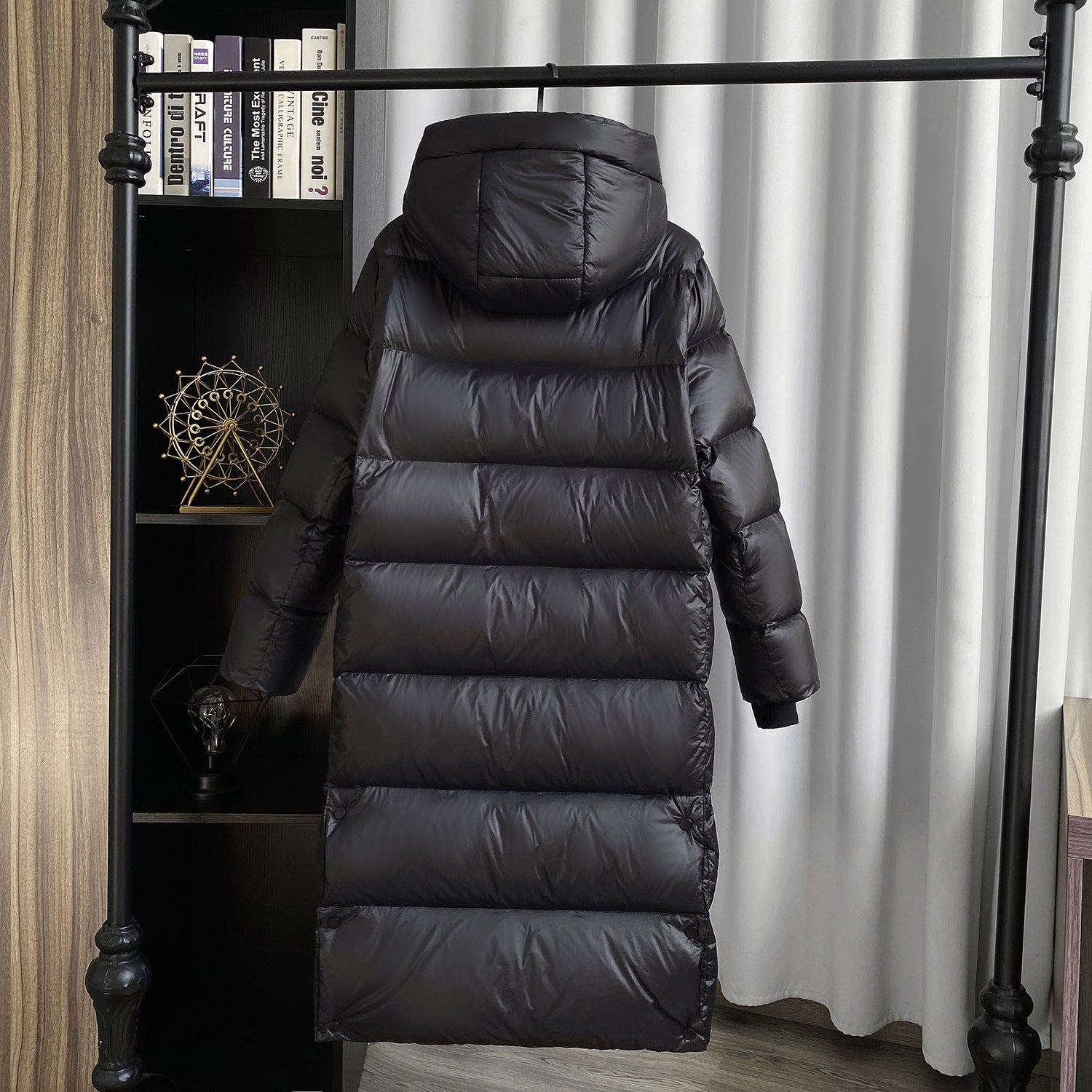 Back view of long puffer coat with hood