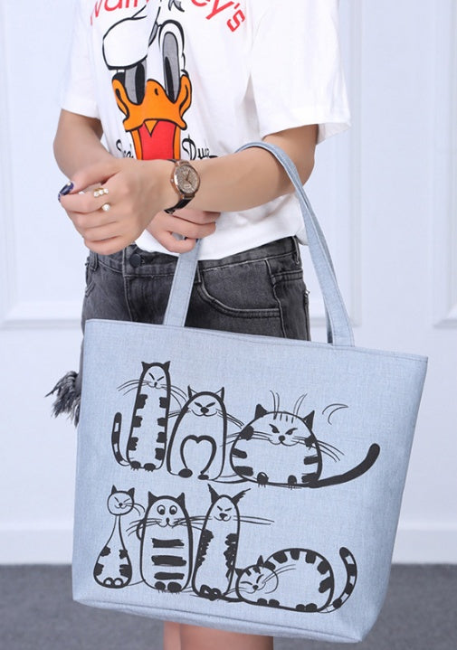 Model carrying a women's grey large tote bag