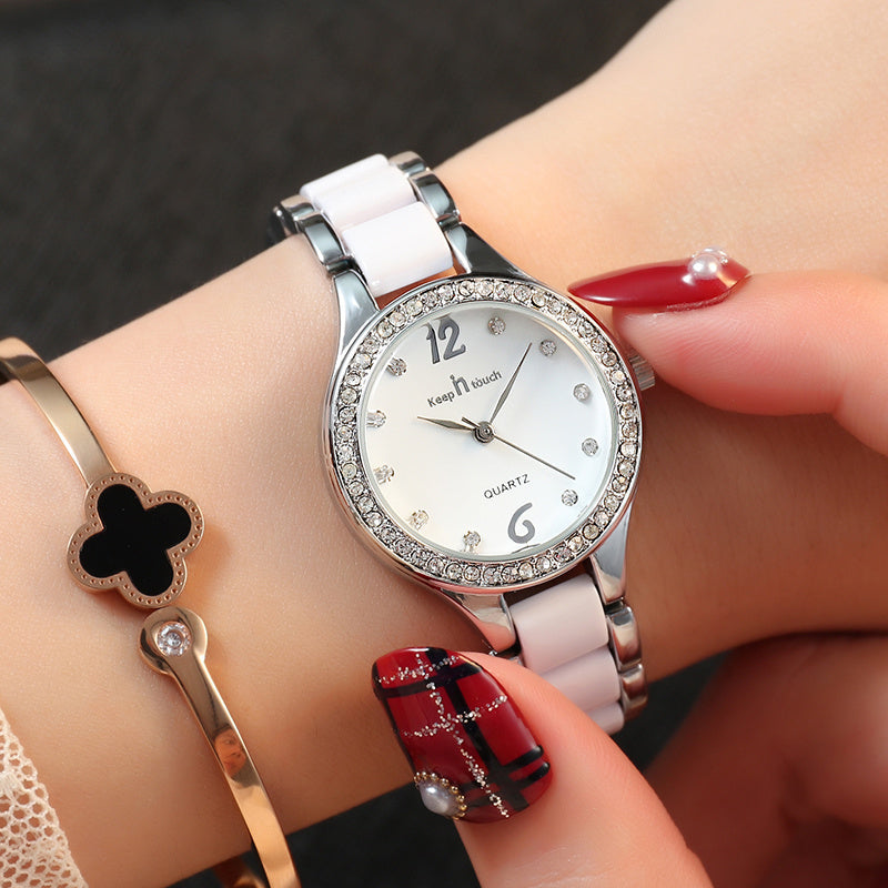 Women's beautiful wristwatch which combines  steel and ceramic with stylish zirkonia bezel