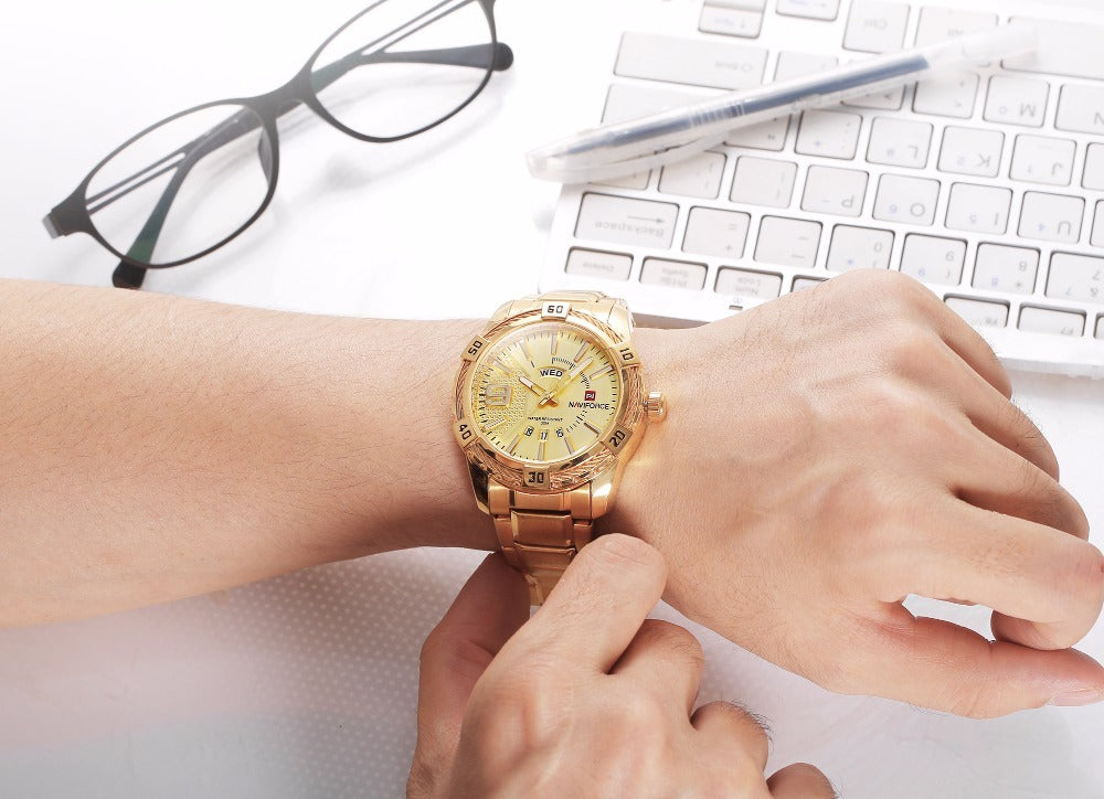 Model wearing gold NAVIFORCE watch showcasing bold design and durable materials.