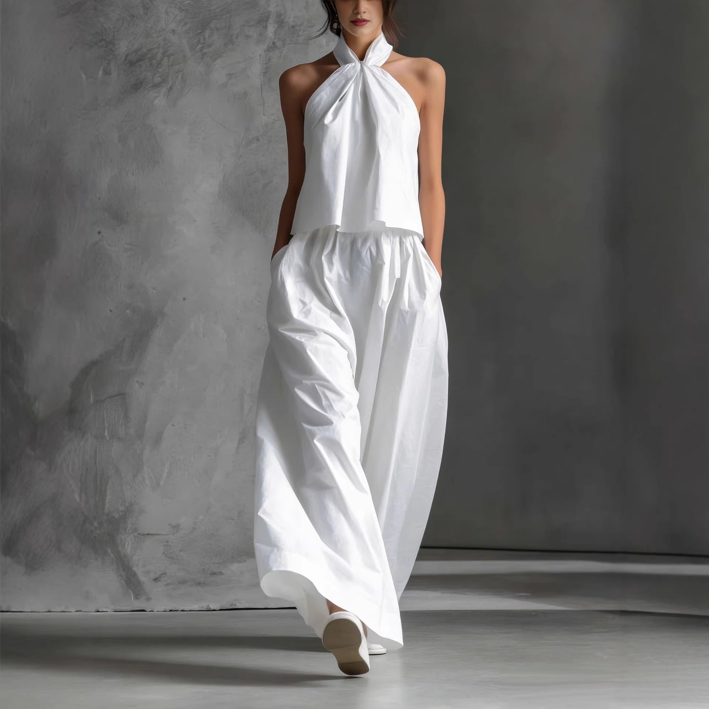 White minimalist halter neck set with wide-leg pants