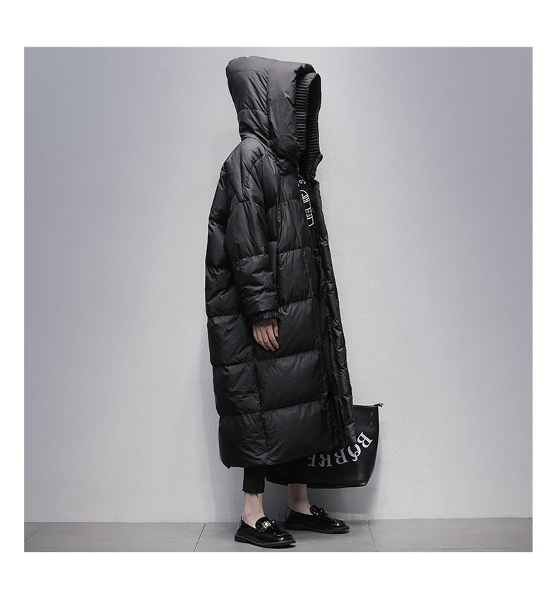 Side view of black long winter down coat with hood