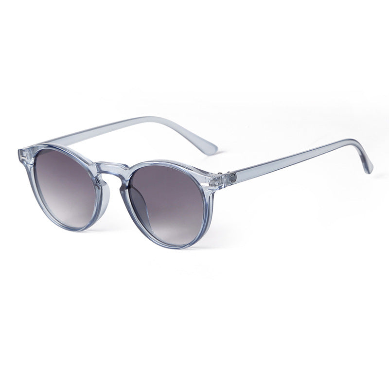 Translucent frame sunglasses with blue-grey gradient lenses, minimal and fresh look.