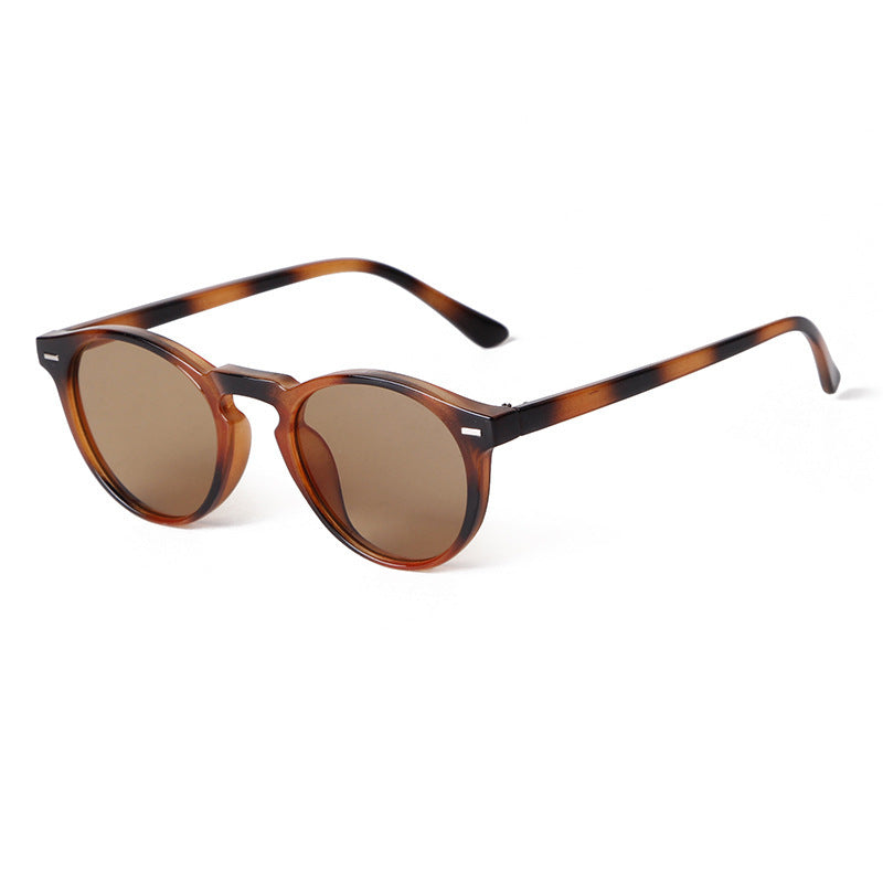 Light tea-colored sunglasses with subtle amber tones and soft brown lenses.