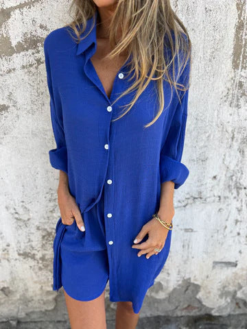 Model wearing blue relaxed oversized button-up shirt and comfy shorts