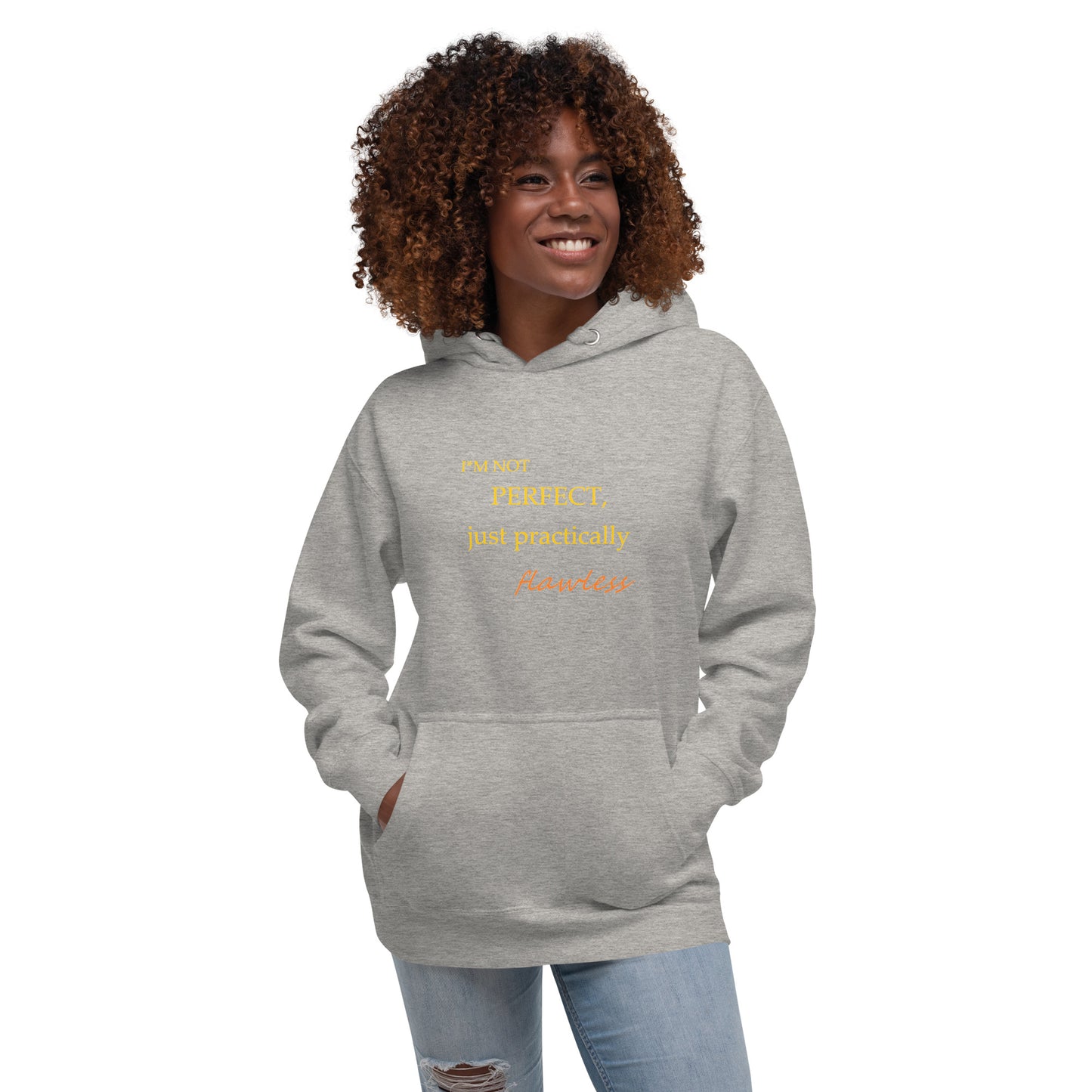 Model wearing a carbon grey unisex hoodie with "I'm not perfect, just practically flawless" design, hands in pocket, smiling.