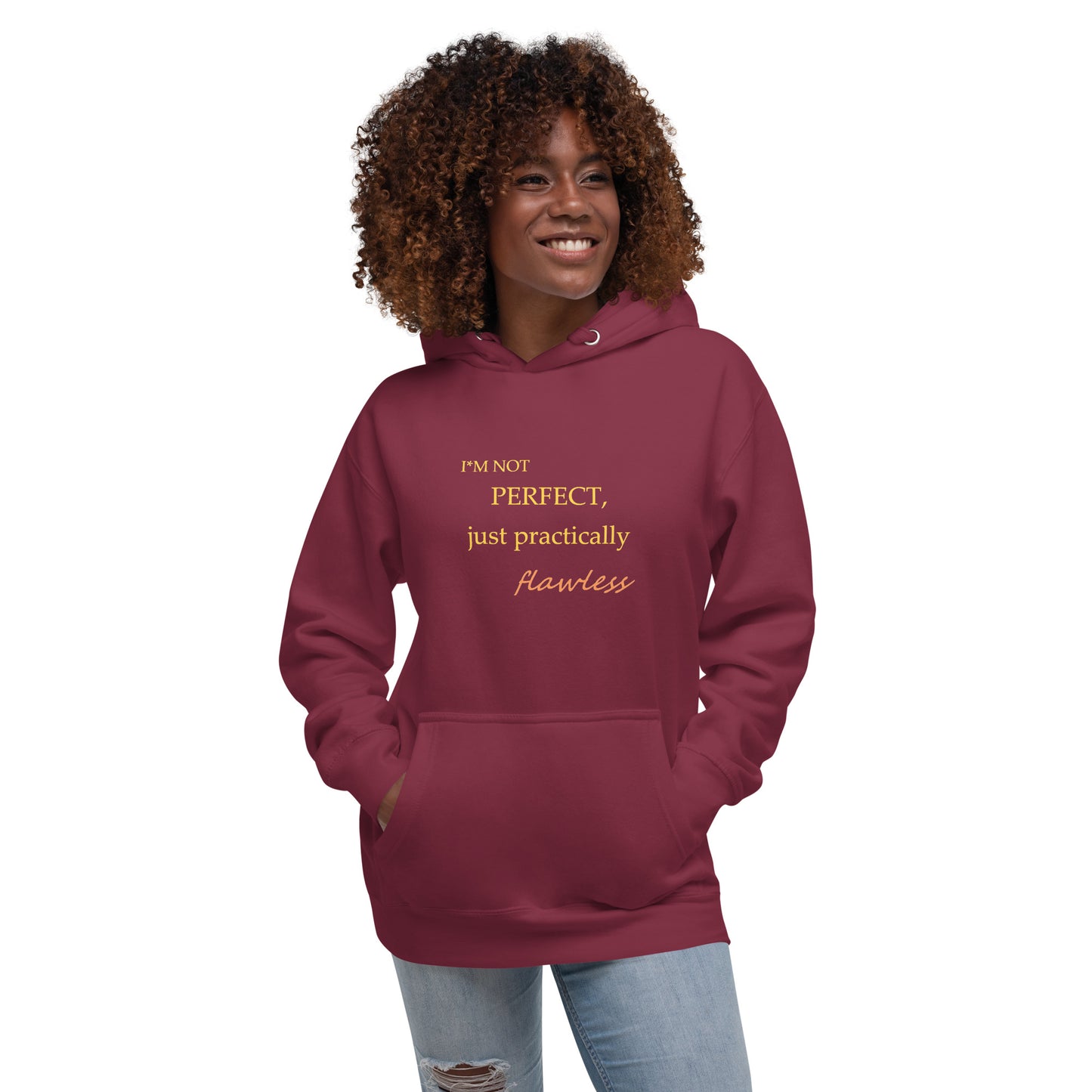 Model wearing a maroon unisex hoodie with "I'm not perfect, just practically flawless" design, hands in pocket, smiling.