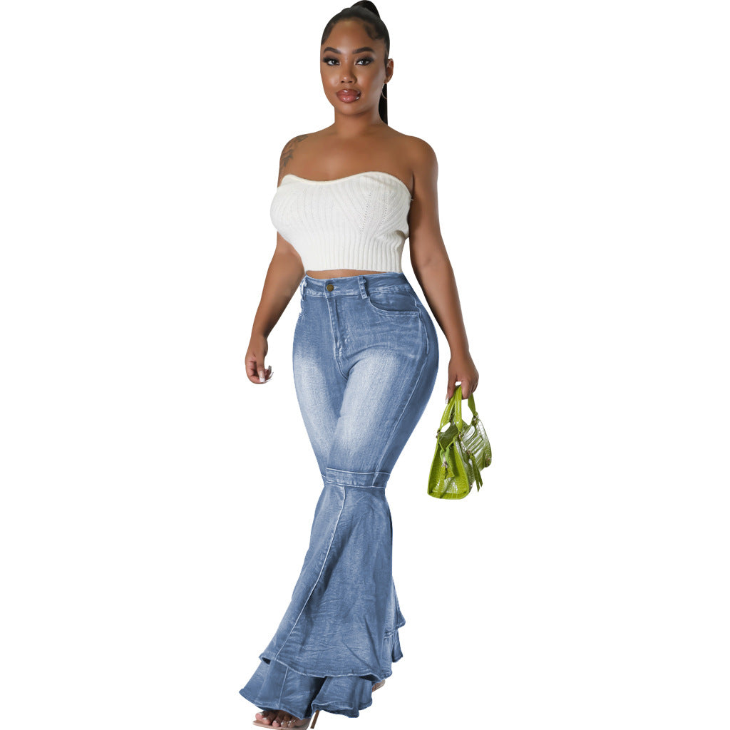 Side view of wide leg flared light blue denim jeans with high waist.