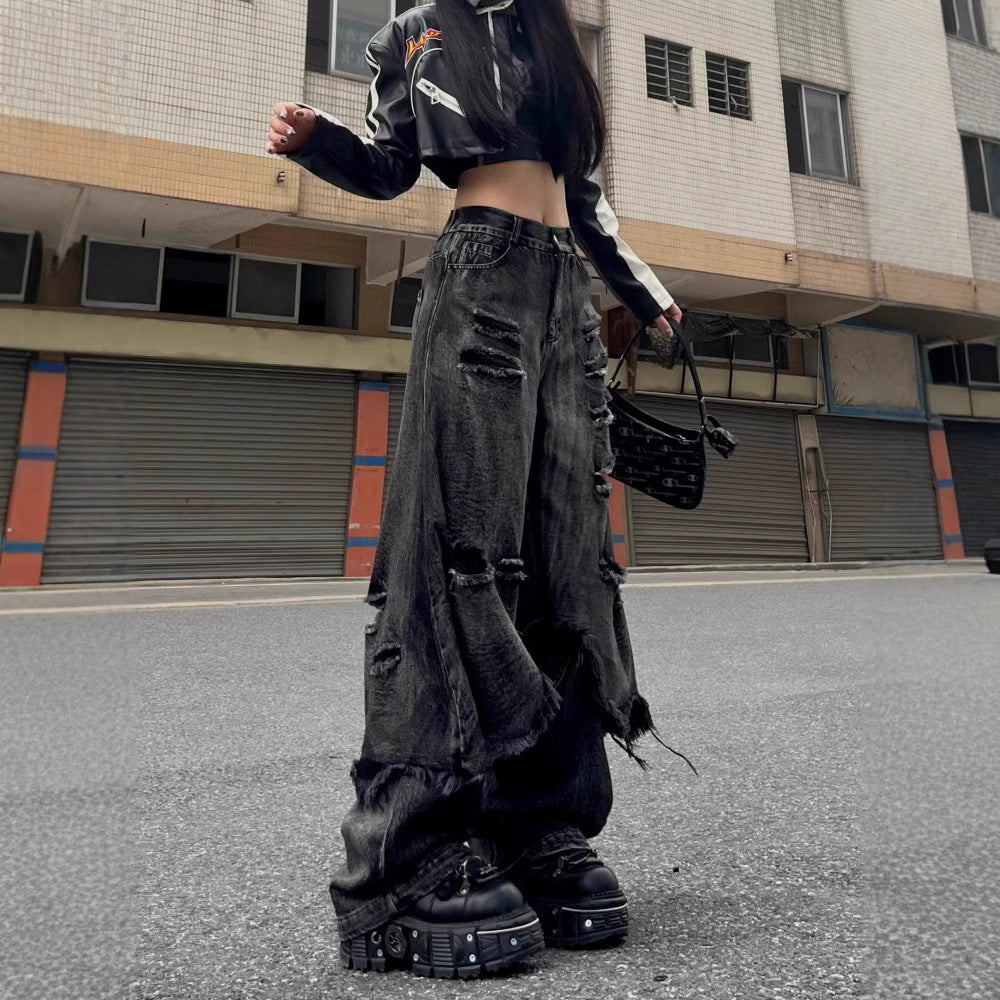 Wide-leg ripped jeans with raw edges and frayed hems