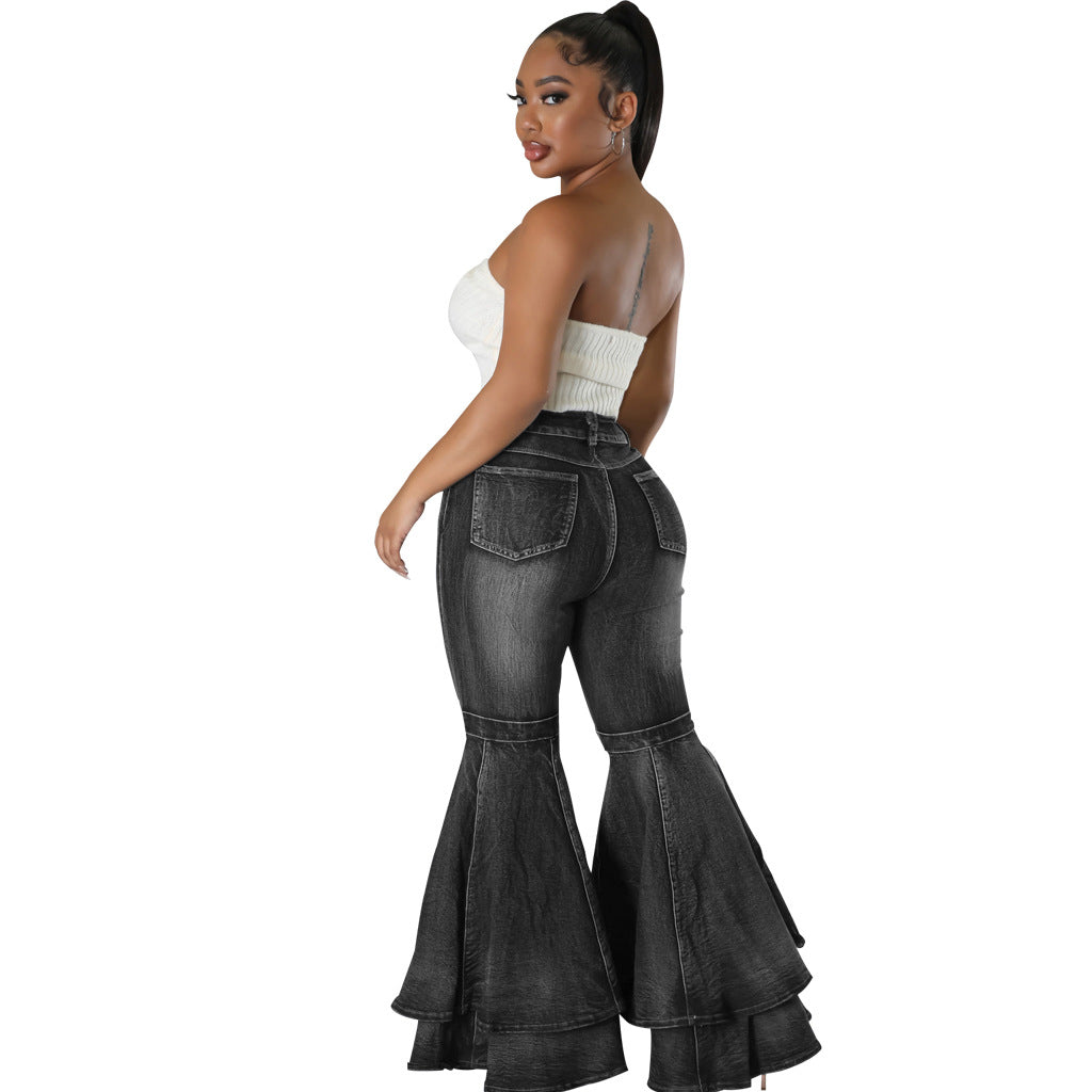 Side view of wide leg flared black denim jeans with high waist.