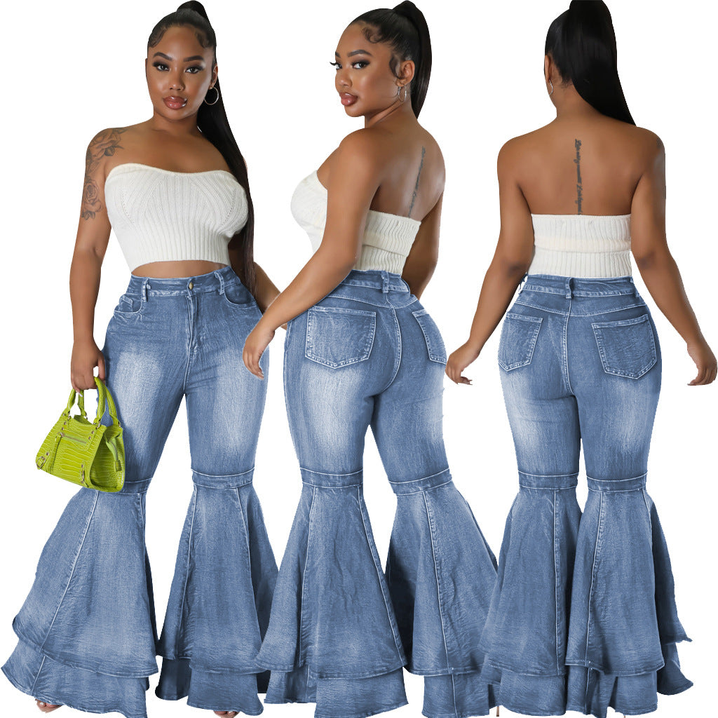 High-waist light blue denim flared jeans, wide leg bell-bottom style.
