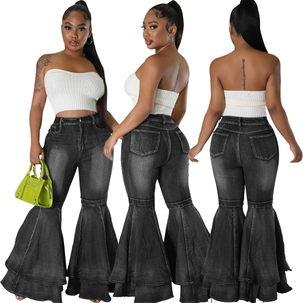 High-waist black denim flared jeans, wide leg bell-bottom style.