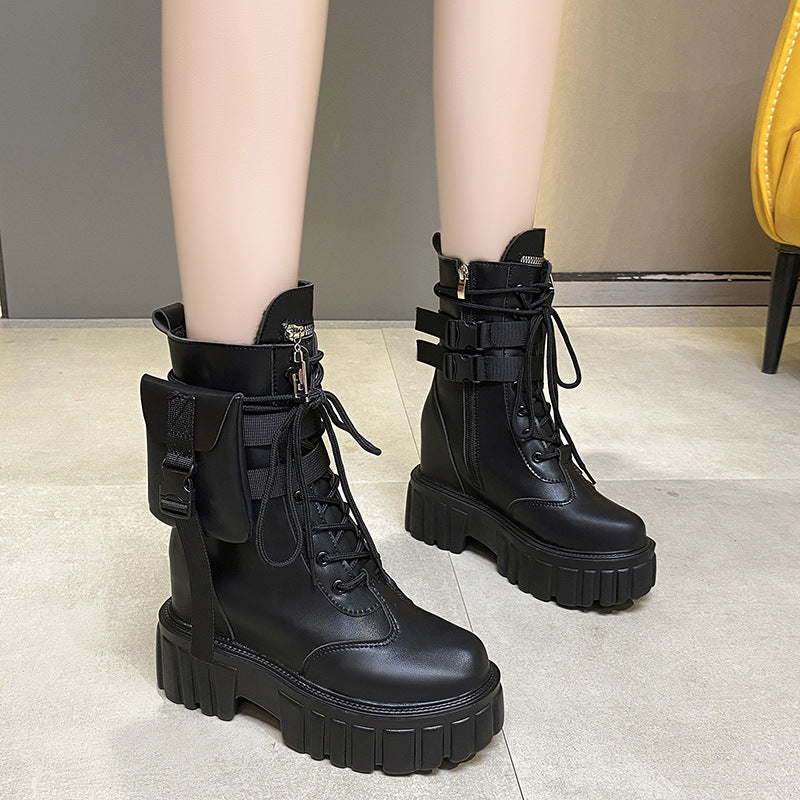 Women wearing black Martin boots with thick soles indoors