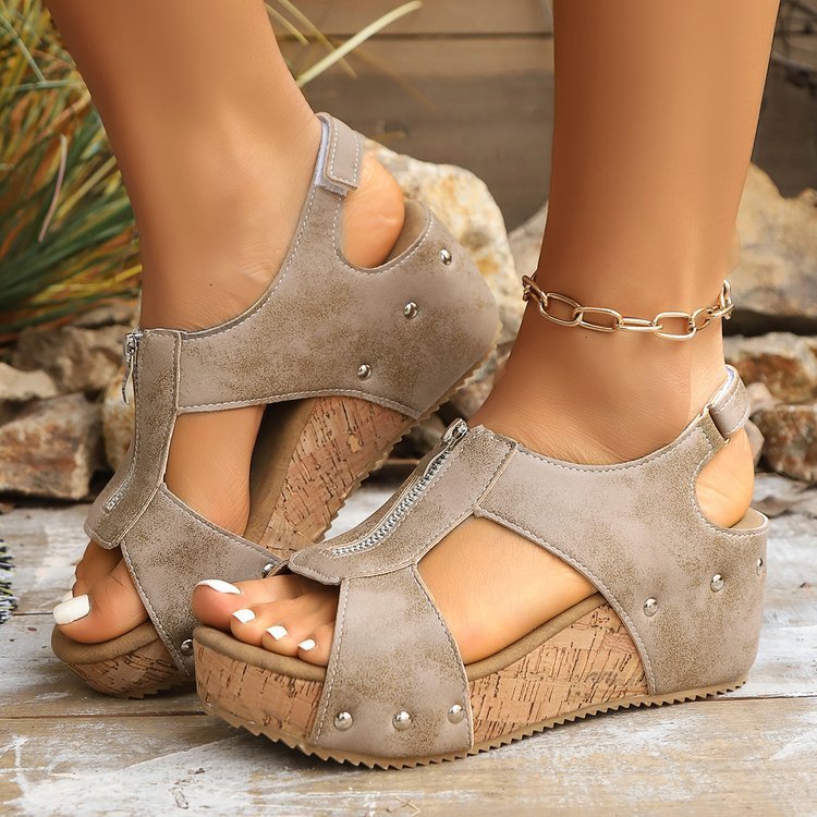 Beige wedge sandals with a stylish zipper closure