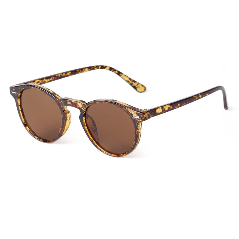 Beige-toned sunglasses with gentle tea-tinted lenses, understated and chic.