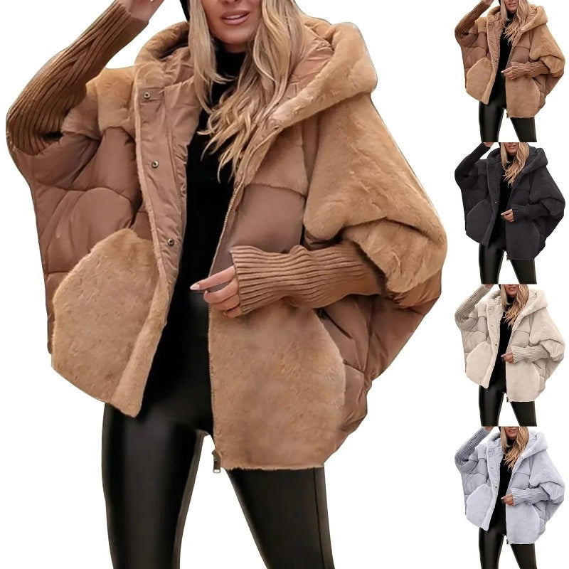 Woman wearing oversized brown faux fur patchwork hooded winter coat, multiple colors