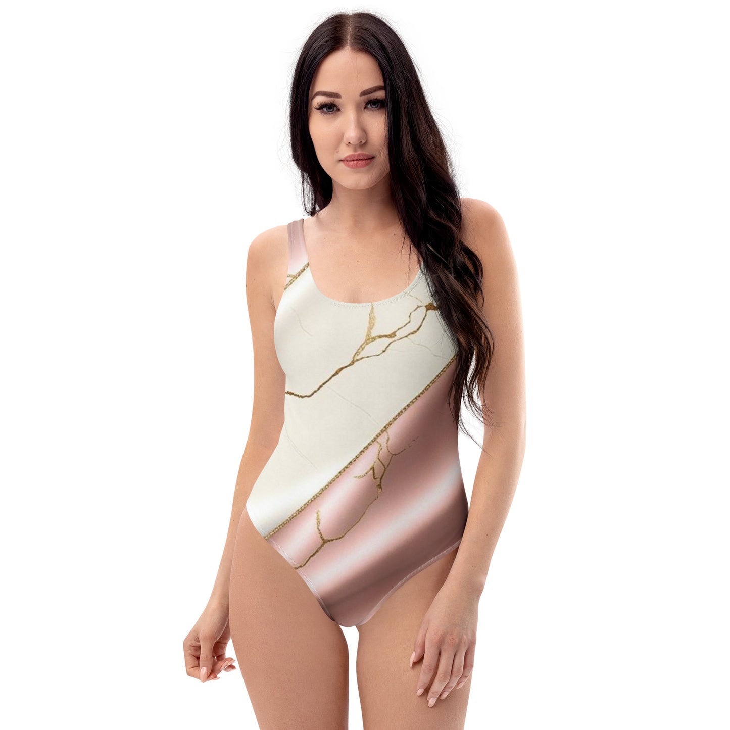 Model wearing Aylure Marble Luxe one-piece swimsuit with marble and rose gold diagonal print.