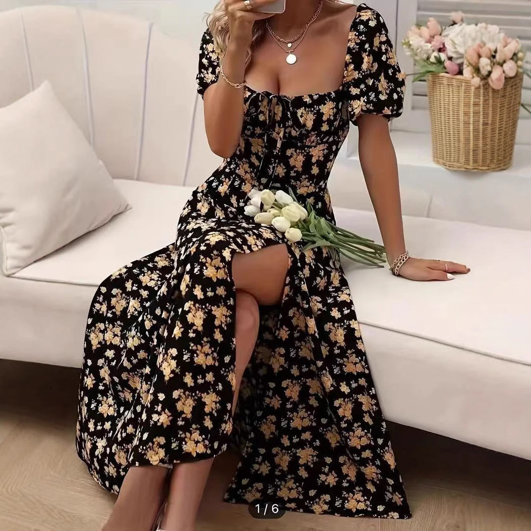 Black dress with yellow floral print and puff sleeves