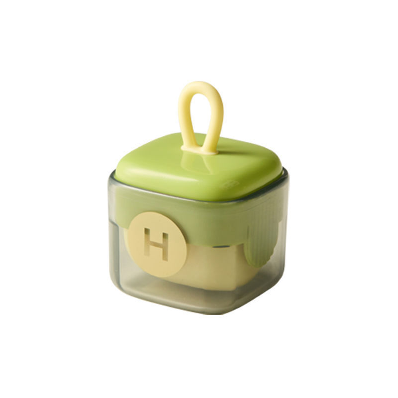 green portable lint remover