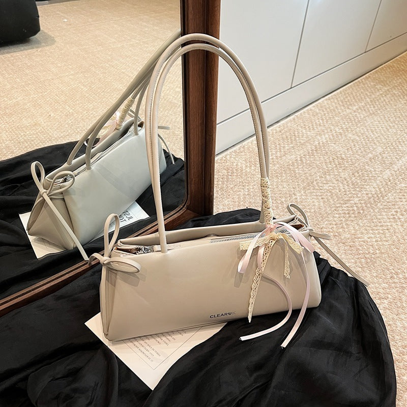 Light grey shoulder bag in soft pastel tone