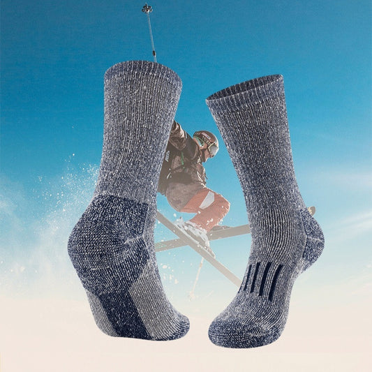 Wool-blend ski socks in action – gray blue pair against a winter sports background