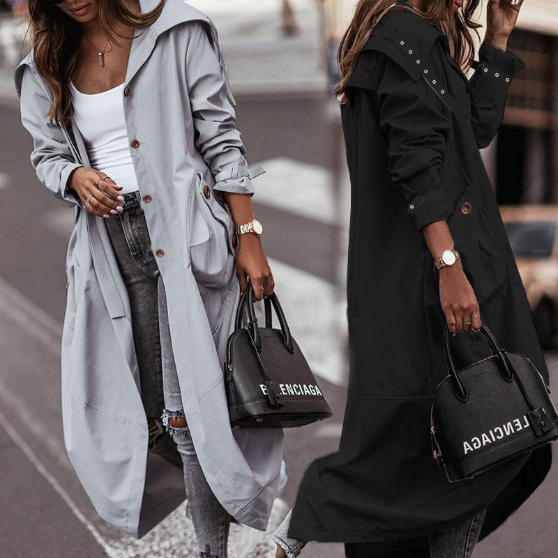 Women wearing black and grey long lapel trench coat, street style