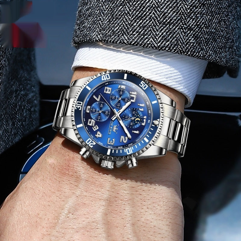 Blue and silver OLEVS watch on wrist – suit-ready luxury style