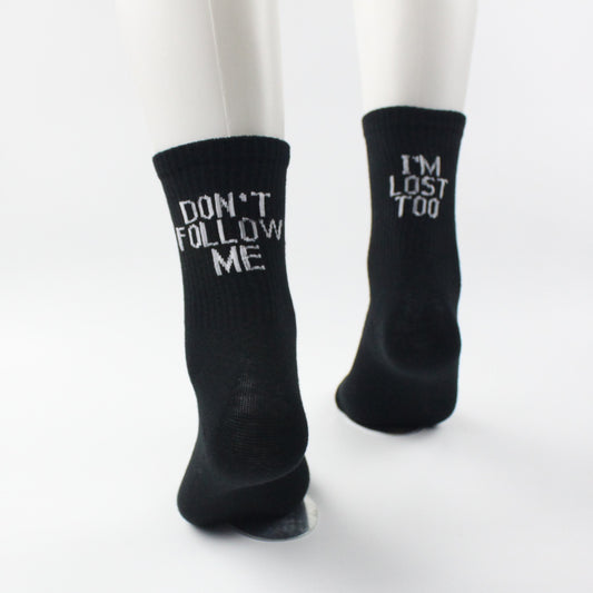 Playful black unisex text socks "Don't follow me, I'm lost too"