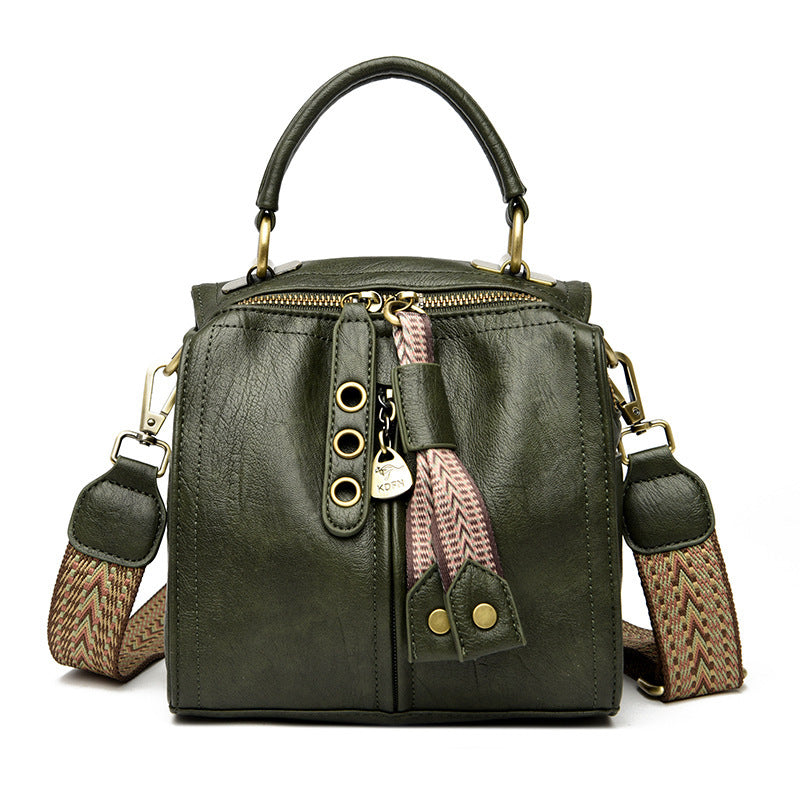 Green multi-compartment shoulder bag with zipper accents