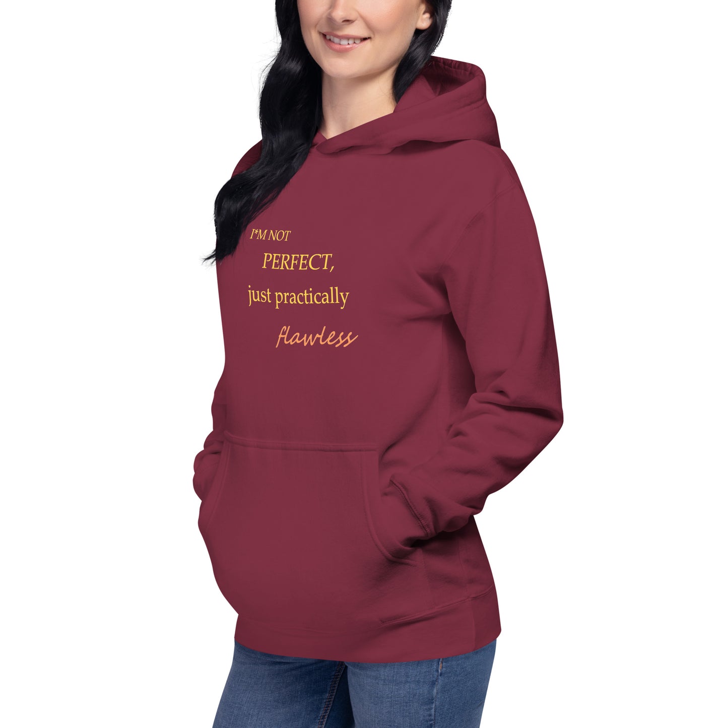 Model wearing a maroon unisex hoodie with "I'm not perfect, just practically flawless" design, hands in pocket, smiling.
